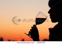 stock-photo-woman-drinking-a-glass-of-wine-by-the-sunset-32093749.jpg